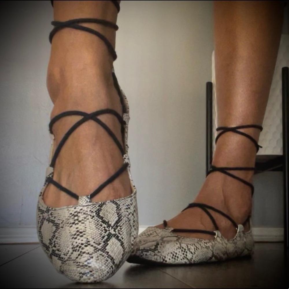 Worn snakeskin lace up flats